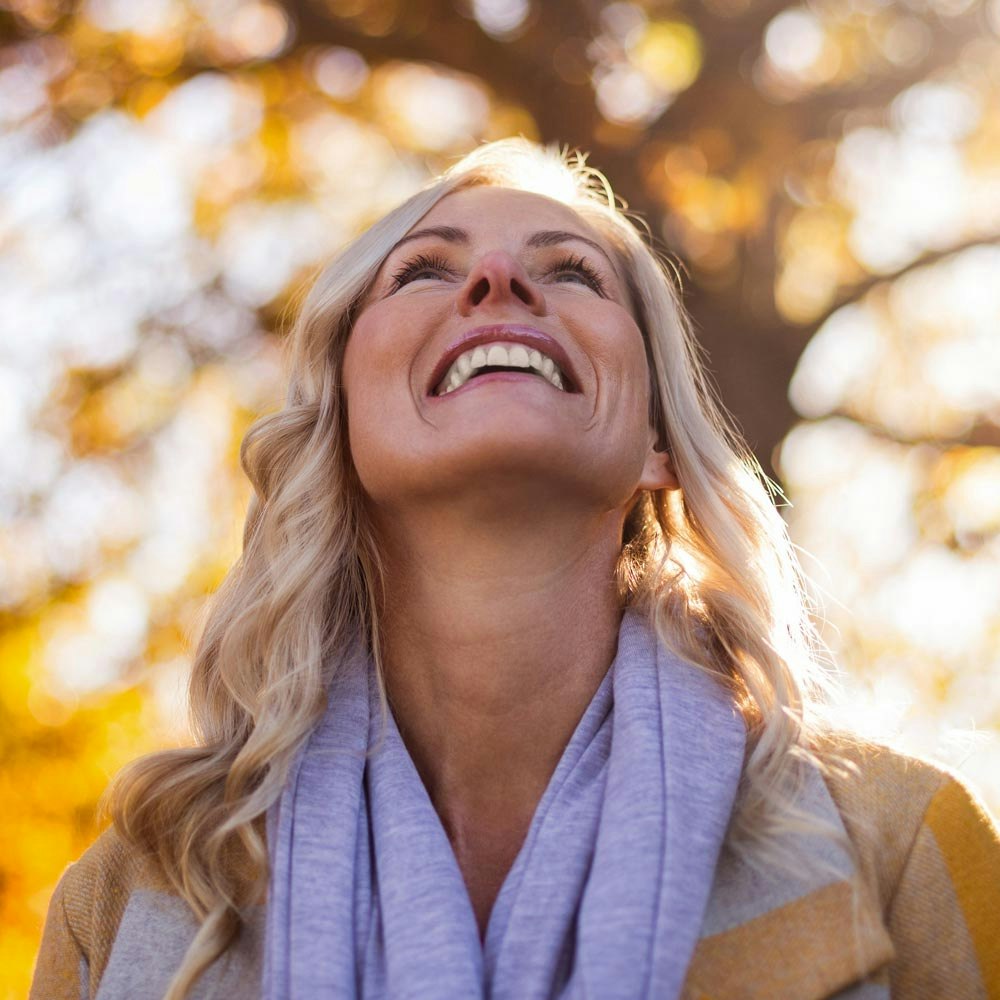 woman smiling in autumn