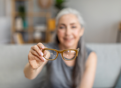 Woman holding glasses