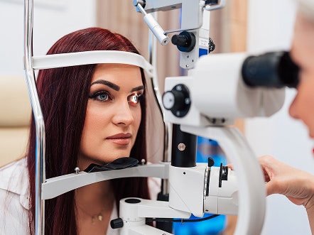 woman undergoing an eye exam