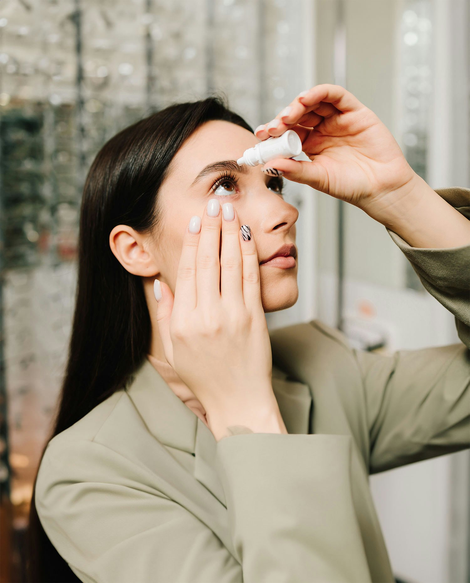 Woman placing eyedrops