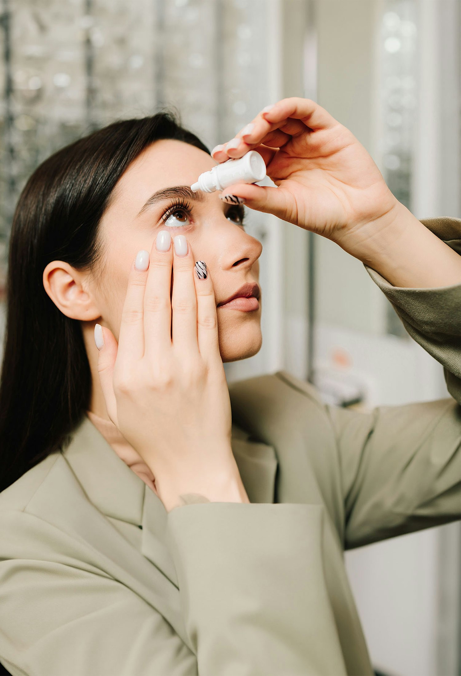 Woman placing eyedrops