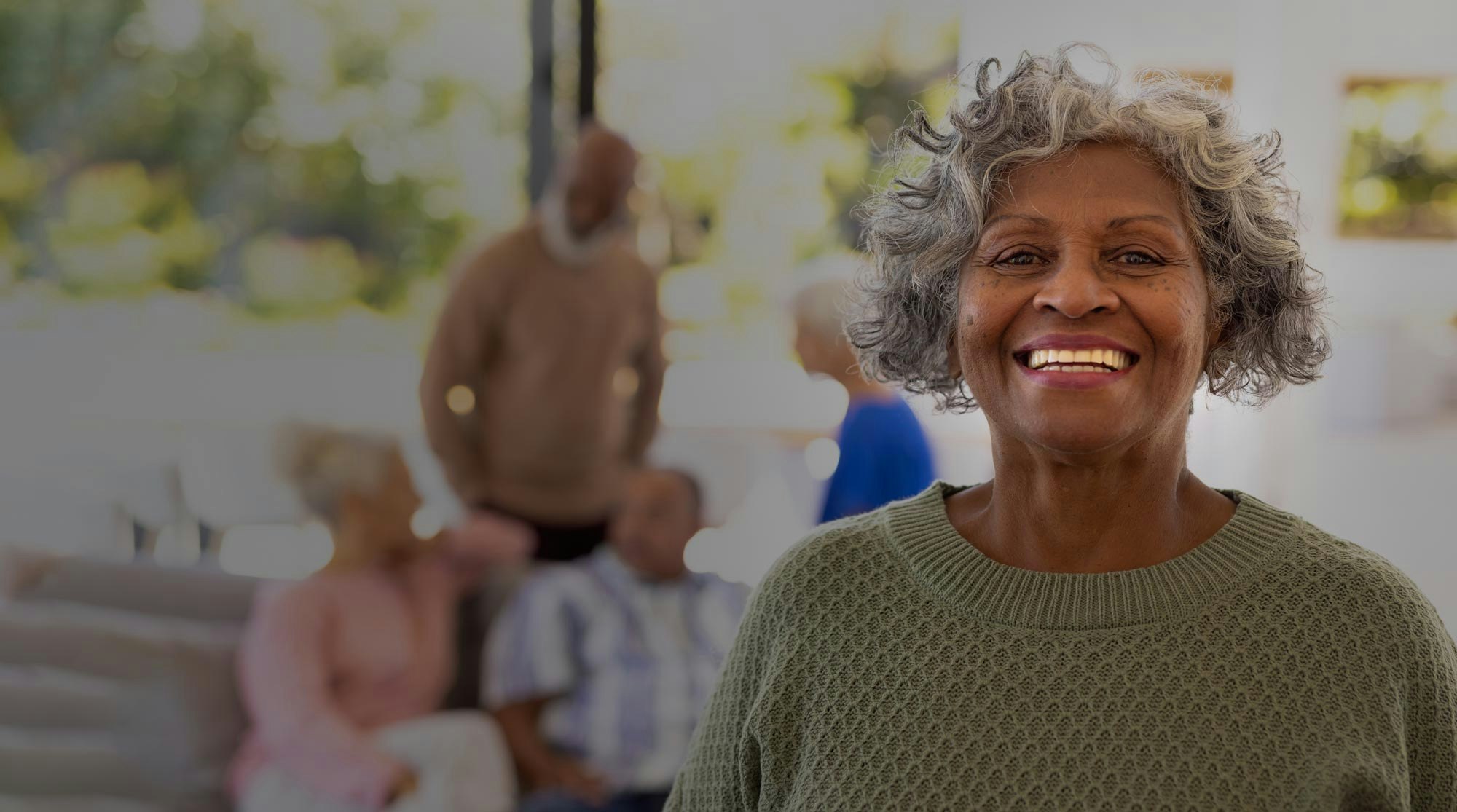 smiling woman in green sweater