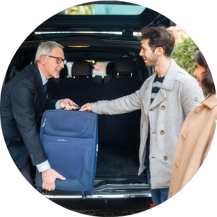 Man helping another with luggage