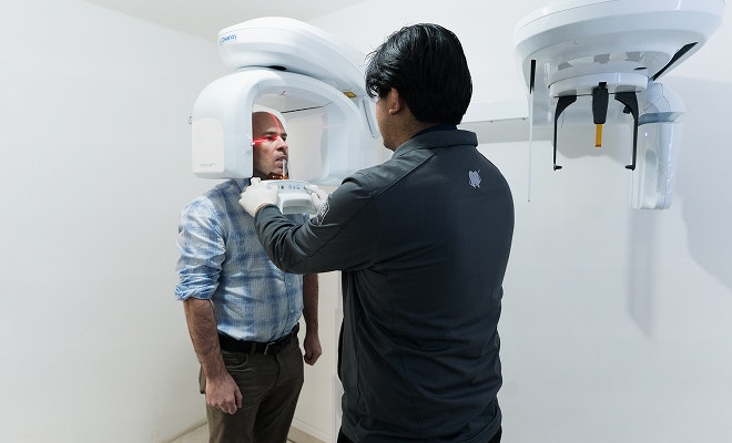 dentist scanning dental patient