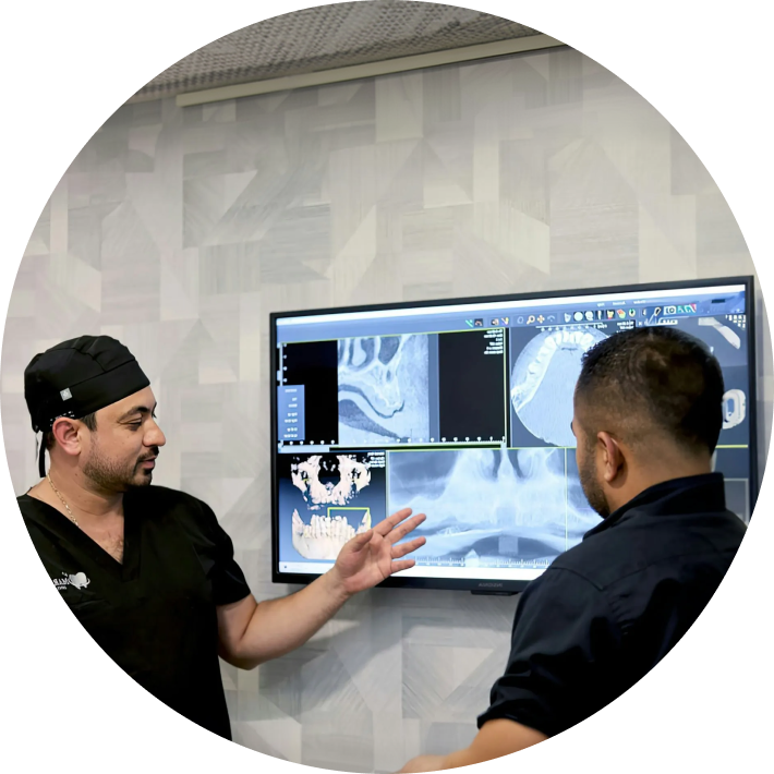 Dentist showing dental scans