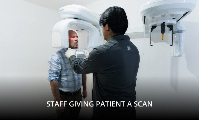 Staff member scanning patient