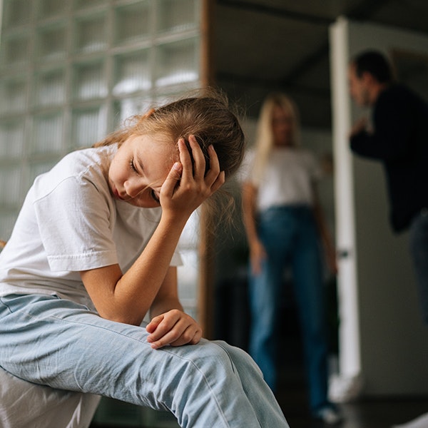 frustrated child with arguing parents