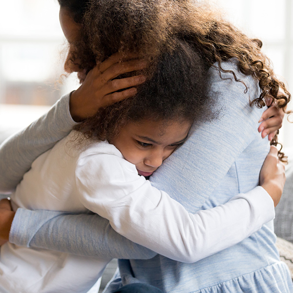 mother comforting her young daughter