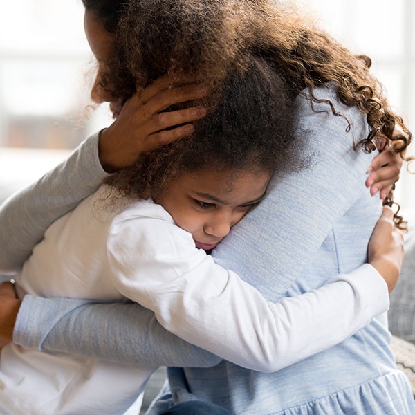 mother comforting her young daughter