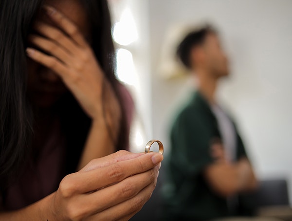 holding a wedding ring