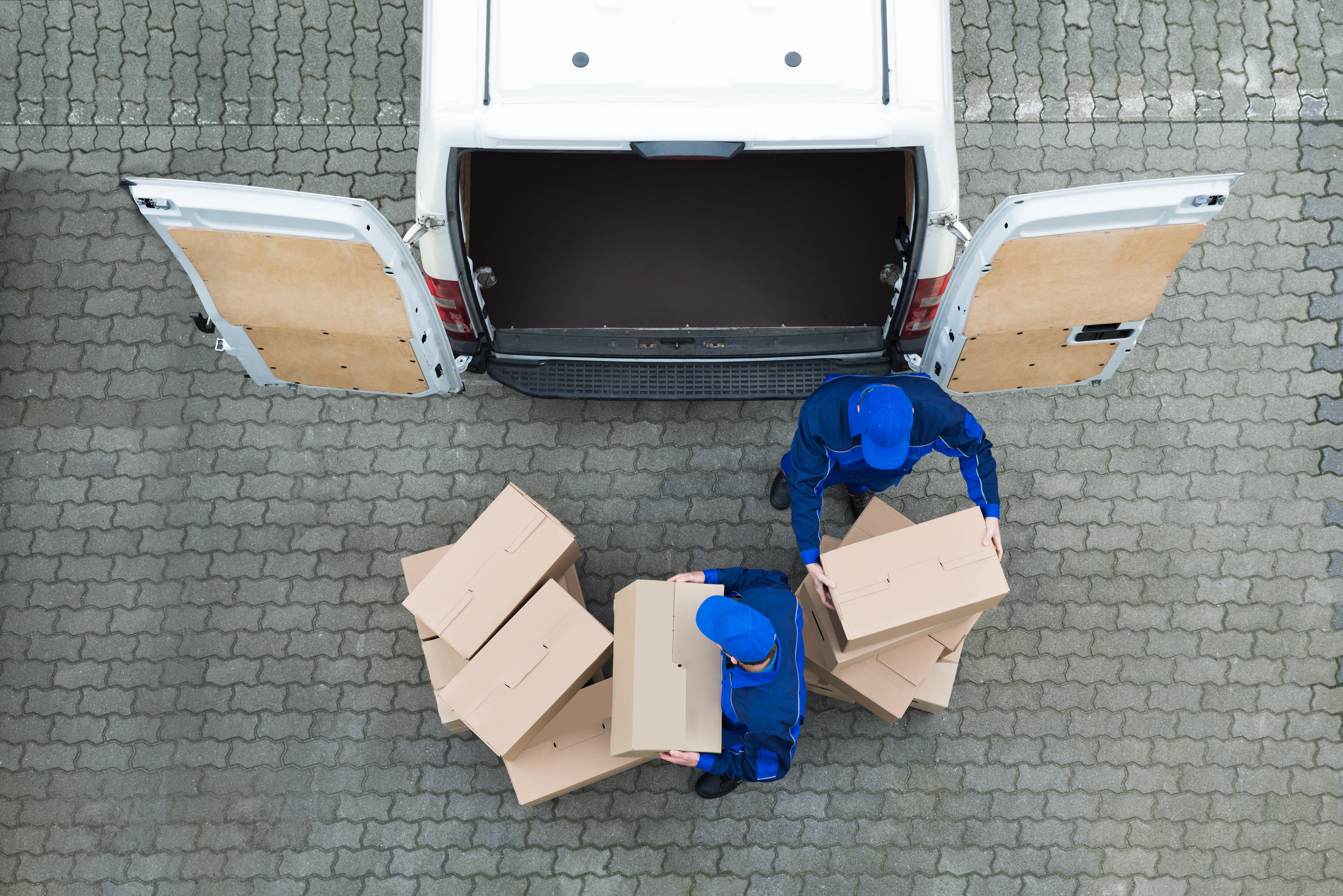 delivery workers loading van