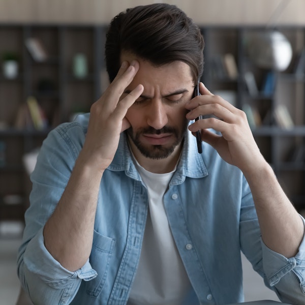 upset man talking on the phone
