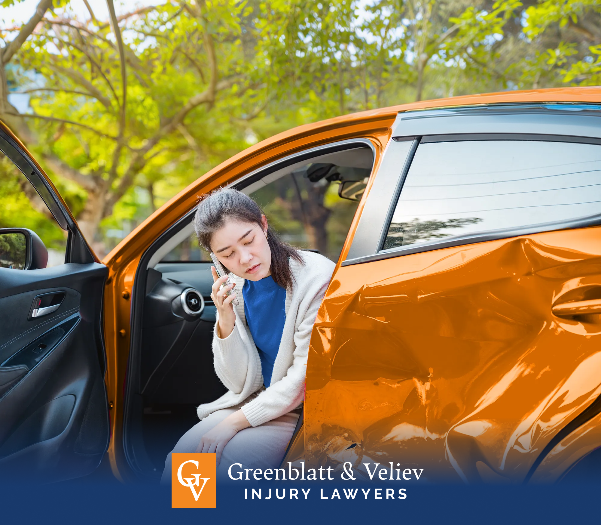 woman making a phone call from her wrecked car