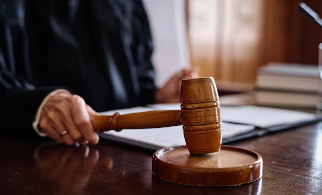 Close-up of judge hitting gavel