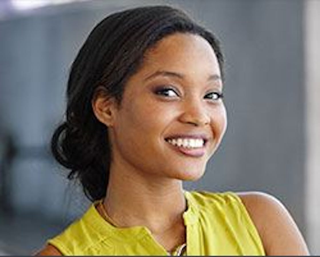 woman in yellow shirt smiling