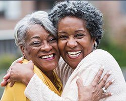 woman hugging each other