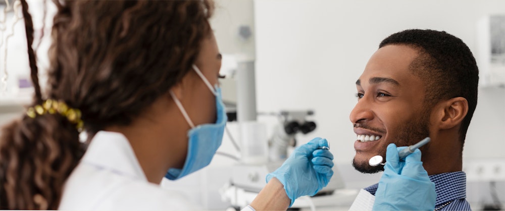 Man smiling during dental treatment