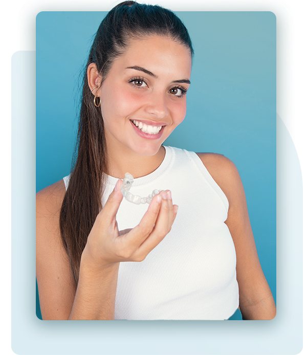 Smiling woman with Invisalign clear aligner