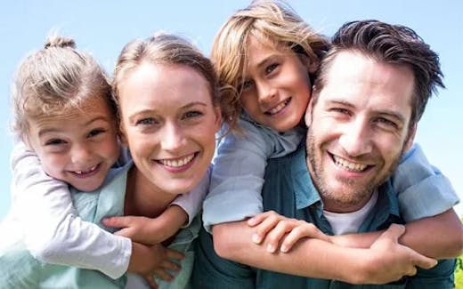 Smiling parents with girl and boy