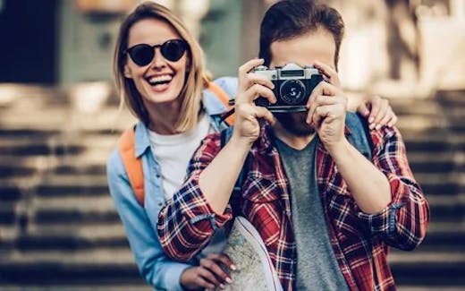 Smiling couple taking pictures