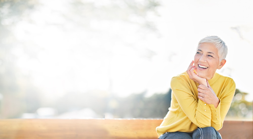 Smiling woman with All-on-4 implants