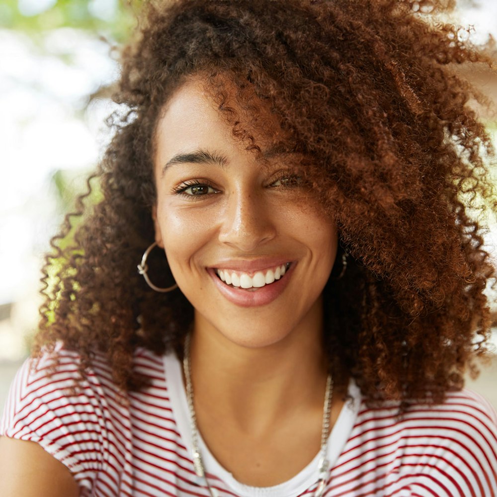 Smiling woman after cosmetic dentistry