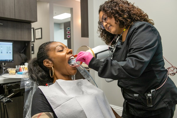 Ata Dental patient getting teeth checked with dental technology