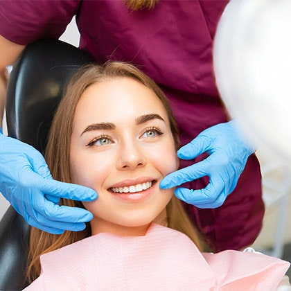 dentist showing patient their smile in a mirror