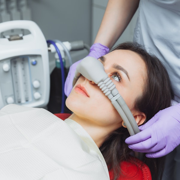Woman undergoing sedation dentistry