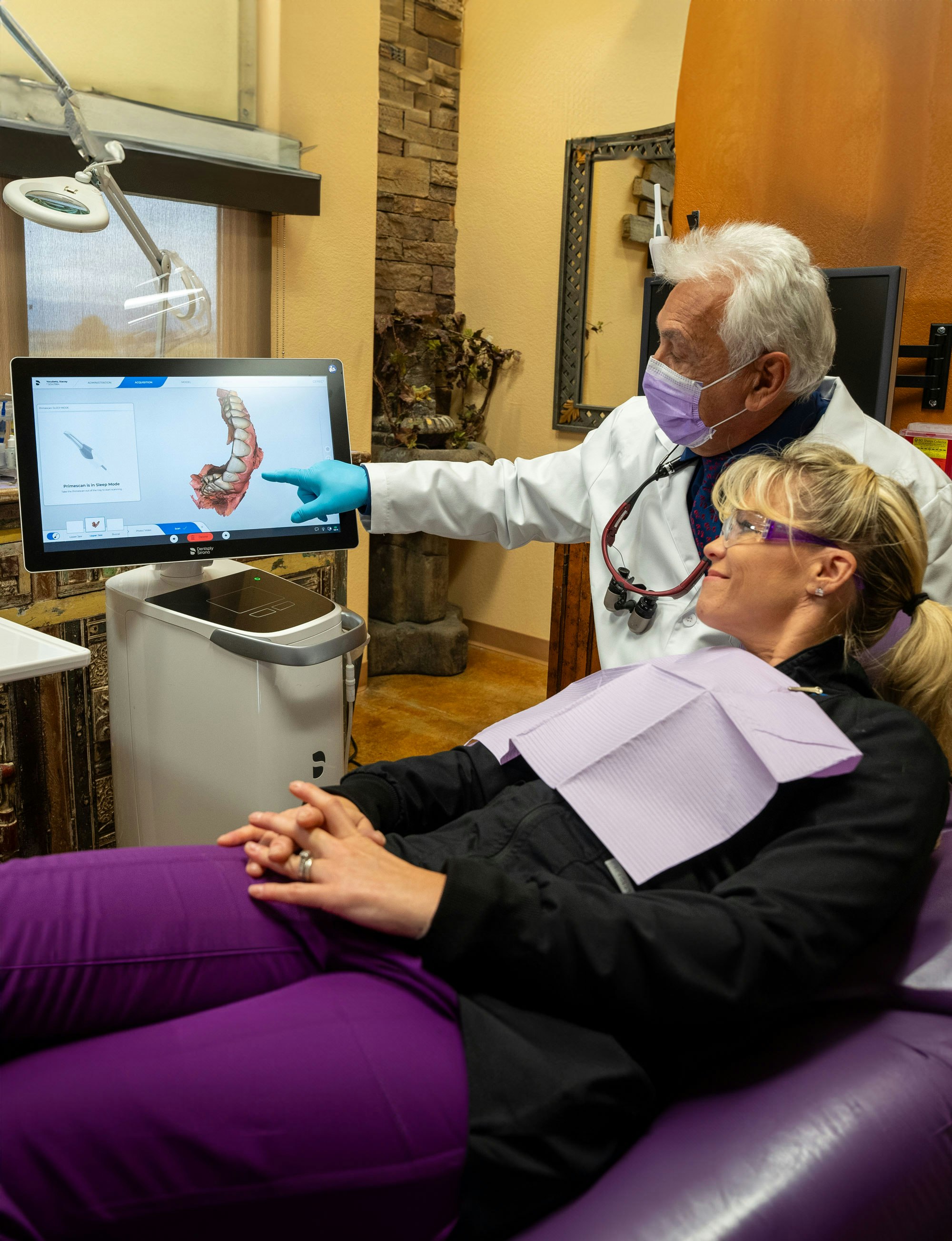 Dr. Rota showing patient scans on computer screen