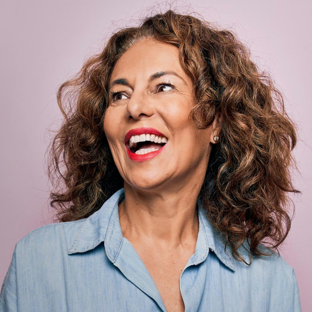 Woman laughing, showing full smile