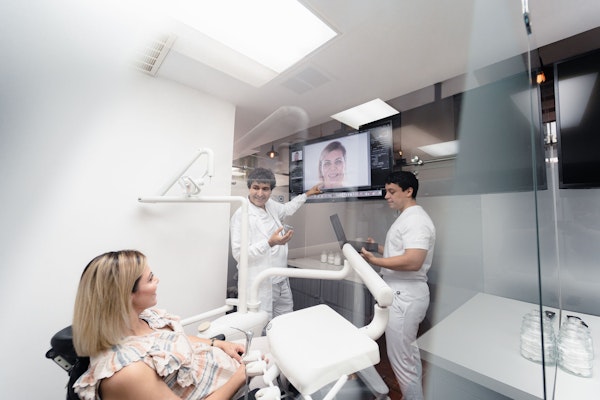 Dentists in Vicente Guerrero, BC, speak with a patient