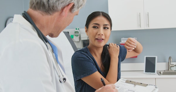Woman at a shoulder consultation