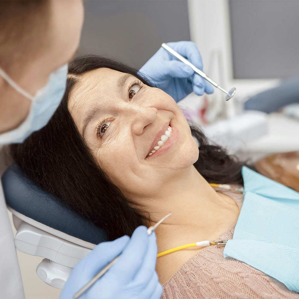 Smiling woman in the xam chair