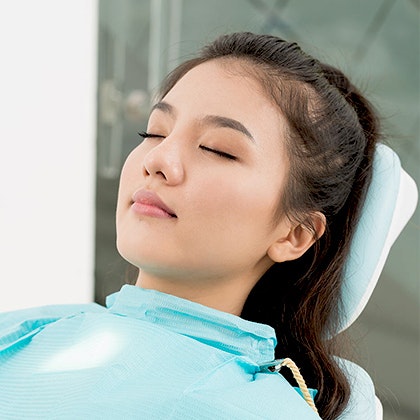 Sedation dentistry patient relaxing with eyes closed