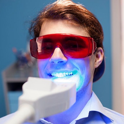 Man undergoing teeth whitening treatment