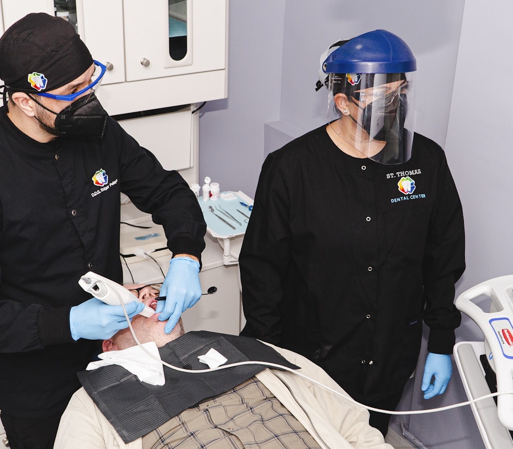 Dr. Pelayo and hygienist taking a 3D scan of patient