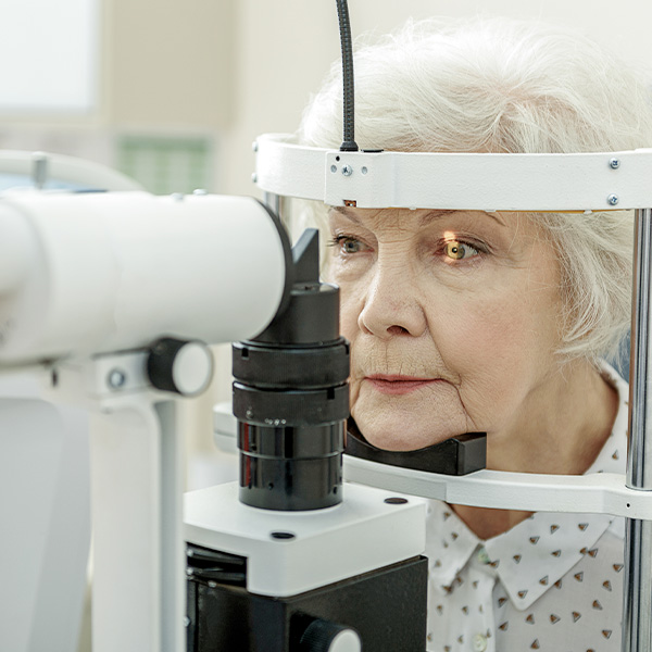 senior woman undergoing eye exam