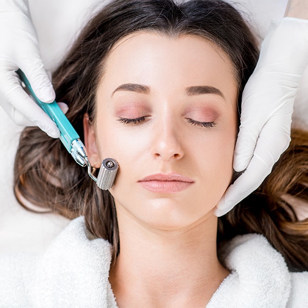 woman undergoing a microneedling treatment