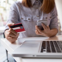 Woman holding credit card