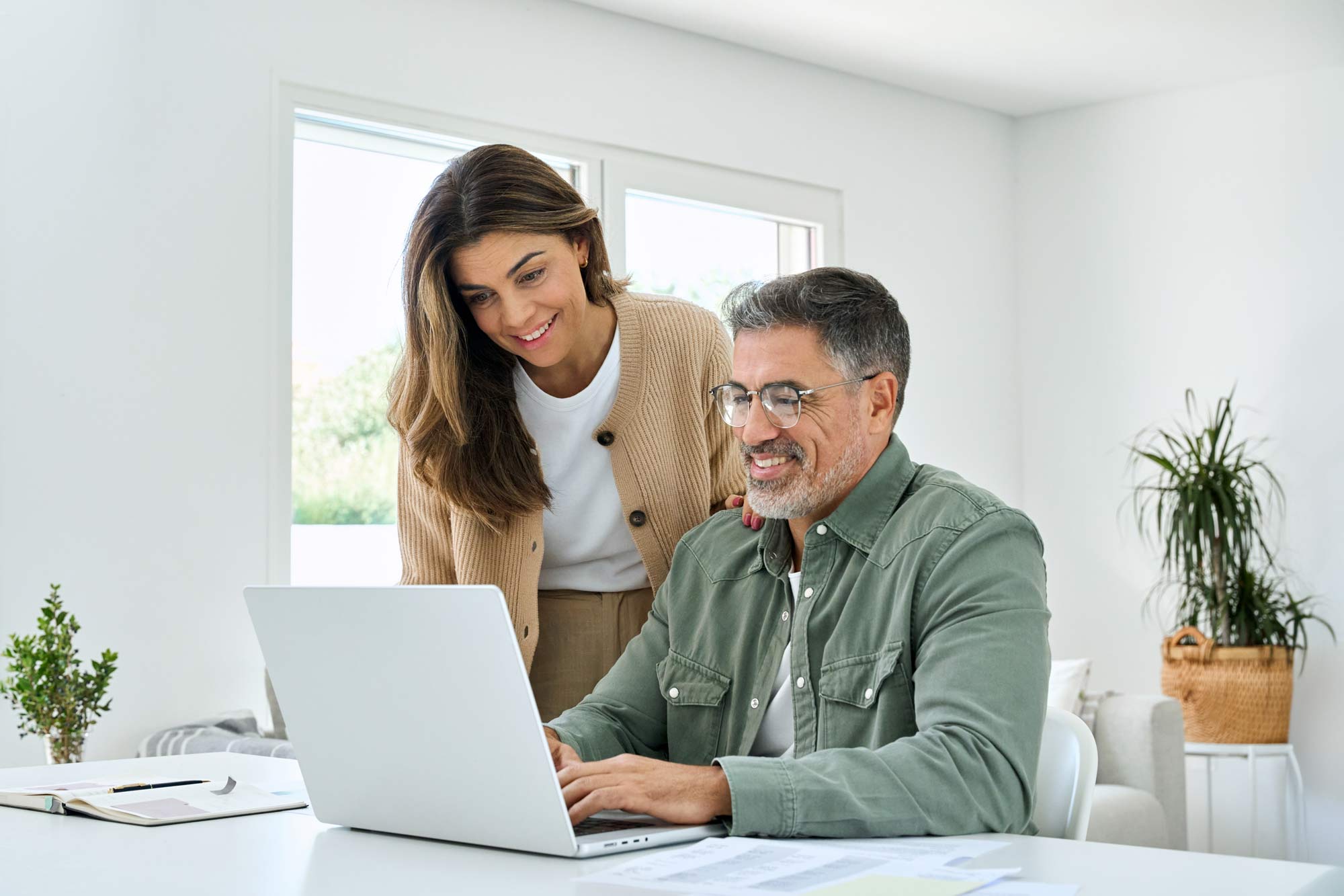 Couple looking at finances in their home