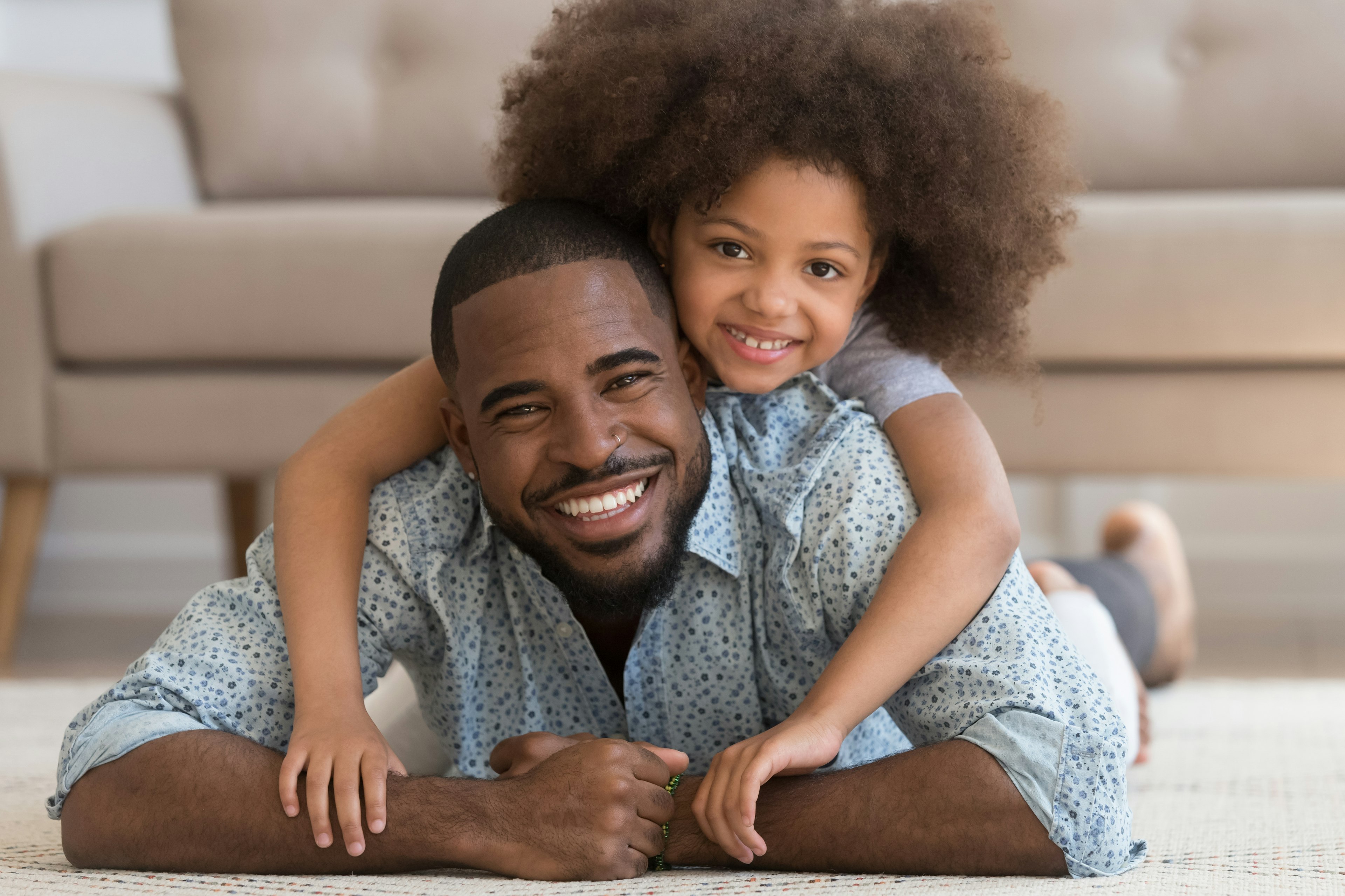 Smiling father and daughter