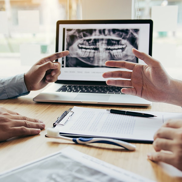 patient and dentist discussing X-rays