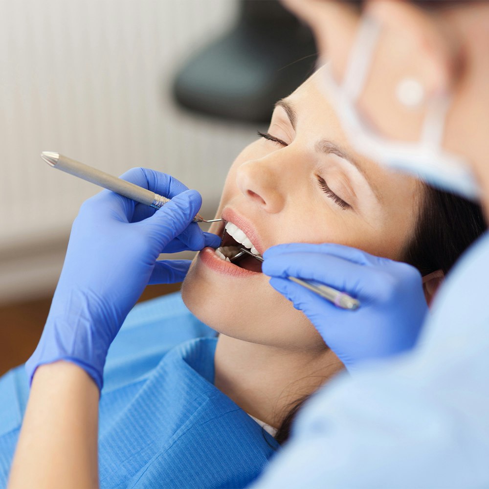 dentist working on female patient