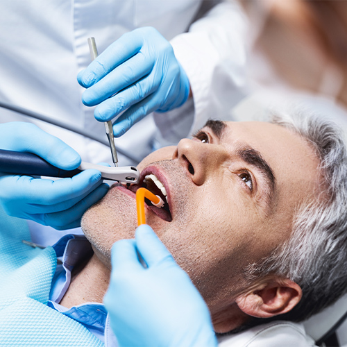 man getting a root canal