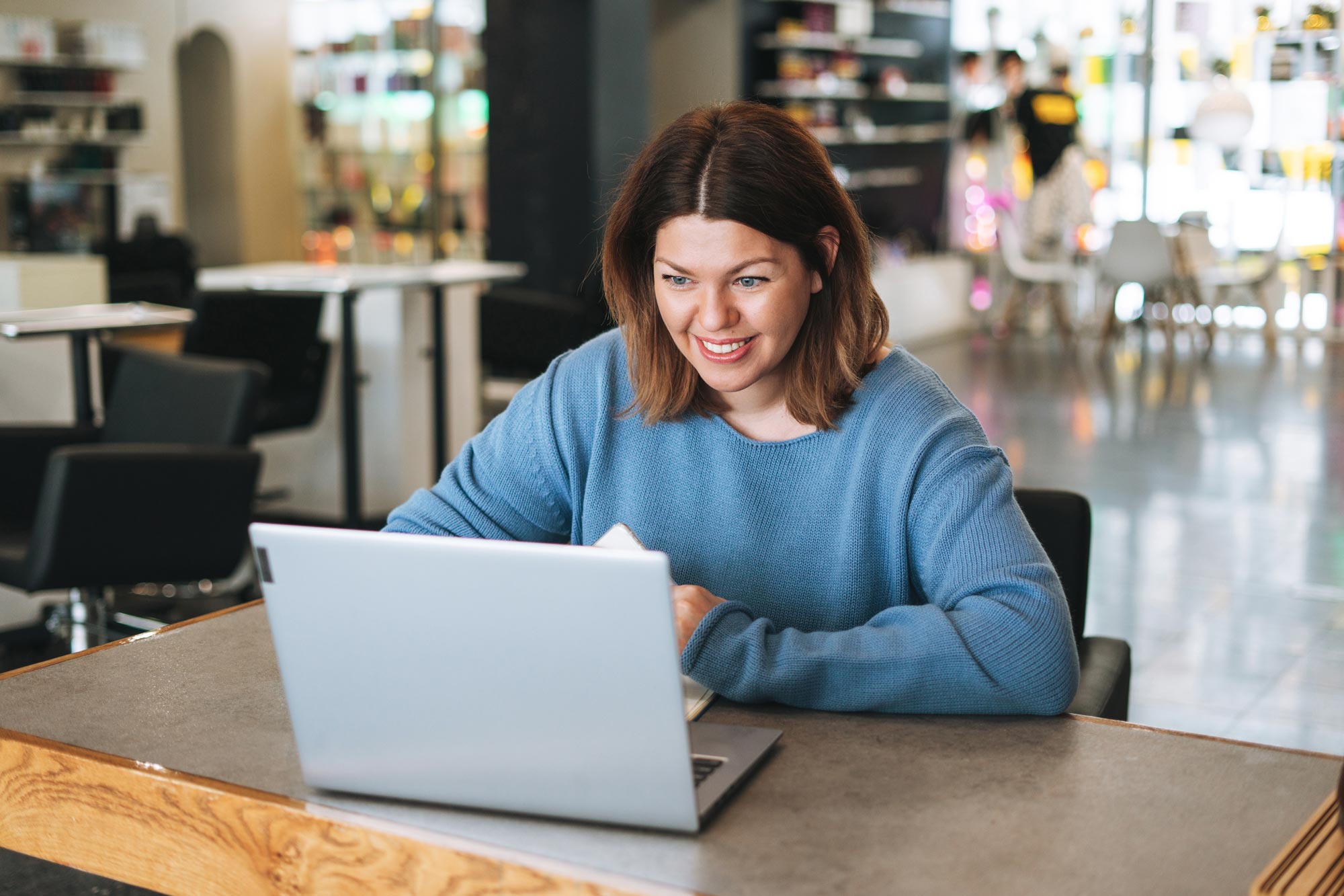 Woman on laptop for virtual consultation