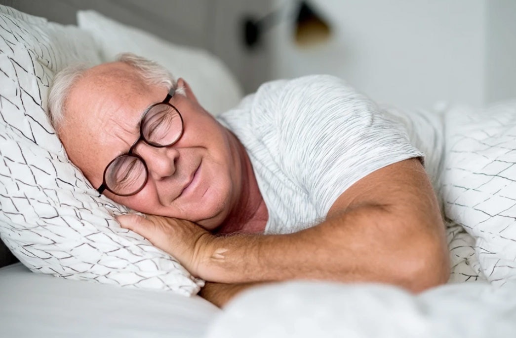 Dr. Macdonald sleeping peacefully in bed
