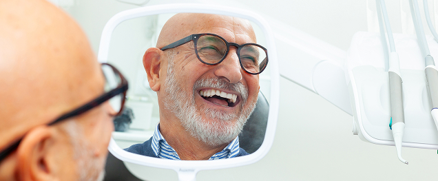 man smiling in mirror