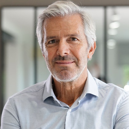 Smiling man after dental bridge treatment