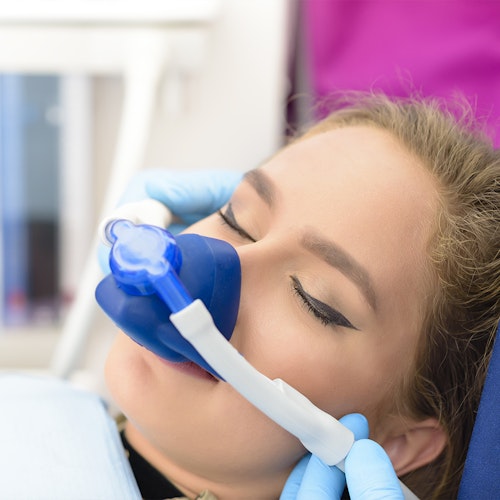 woman with nitrous oxide mask on